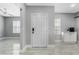 Bright entryway with neutral paint, a secure front door, and tile flooring, creating a welcoming atmosphere at 3223 Queen Alexandria Dr, Kissimmee, FL 34744