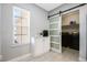 Well-organized laundry room with frosted glass sliding door and additional cabinet and counter space at 3223 Queen Alexandria Dr, Kissimmee, FL 34744