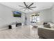 Modern living room featuring a TV and an electric fireplace at 3223 Queen Alexandria Dr, Kissimmee, FL 34744