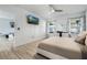 Large bedroom with television and view of outdoor play area at 3223 Queen Alexandria Dr, Kissimmee, FL 34744