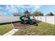 Backyard view of playset with slide at 3223 Queen Alexandria Dr, Kissimmee, FL 34744