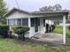 Quaint one-story house with a carport and small, landscaped front yard at 3420 Avenue R Nw, Winter Haven, FL 33881