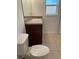 Bathroom featuring a vanity, sink, and toilet with tile flooring at 424 Crabtree Ave, Orlando, FL 32835