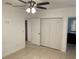 Bedroom featuring tile flooring, a ceiling fan, and a closet with sliding doors at 424 Crabtree Ave, Orlando, FL 32835