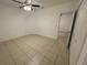 Bedroom featuring tile floors, a ceiling fan, and neutral-colored walls at 424 Crabtree Ave, Orlando, FL 32835