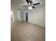 Spacious living room featuring tile flooring and a ceiling fan at 424 Crabtree Ave, Orlando, FL 32835