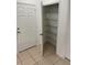 View of walk-in pantry with metal shelving and tile flooring at 424 Crabtree Ave, Orlando, FL 32835