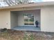 Covered patio featuring neutral paint and a sliding glass door at 424 Crabtree Ave, Orlando, FL 32835