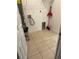 The utility room features tile flooring, a water heater, and washer-dryer hookups at 424 Crabtree Ave, Orlando, FL 32835