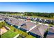 Overhead shot of a neighborhood showing the roofs and backyard of many homes at 4485 Davos Dr, Clermont, FL 34711