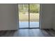 A room with sliding glass doors leads to a yard at 4875 Sw 159Th Lane Rd, Ocala, FL 34473