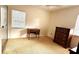 Bright bedroom featuring carpet, a window for natural light, and dresser at 5339 Cypress Dr, Winter Park, FL 32792