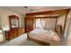 Inviting main bedroom featuring a four poster bed, carpet flooring, and an array of furniture at 5339 Cypress Dr, Winter Park, FL 32792