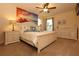 Beach-themed bedroom with white furniture, a ceiling fan, and a decorative ocean mural wall at 5384 Oakbourne Ave, Davenport, FL 33837