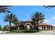 Community center featuring red tiled roof surrounded by palm trees at 5384 Oakbourne Ave, Davenport, FL 33837