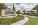 A beautiful entrance sign welcomes you to the Solterra Resort community with lush landscaping at 5384 Oakbourne Ave, Davenport, FL 33837