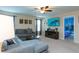 A spacious living room with a gray sectional couch and tv at 5384 Oakbourne Ave, Davenport, FL 33837