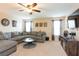 A comfortable living room features a gray sectional couch and TV at 5384 Oakbourne Ave, Davenport, FL 33837