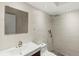 Modern bathroom with a sink, mirror, tiled walls, and a shower with a hand-held shower head at 662 Sausalito Blvd, Casselberry, FL 32707