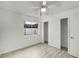 Well-lit bedroom with a ceiling fan, neutral-toned walls, and a closet with sliding doors at 662 Sausalito Blvd, Casselberry, FL 32707