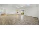 Bright living room featuring light wood floors, white walls, and natural light from windows and skylights at 662 Sausalito Blvd, Casselberry, FL 32707