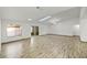 Bright and airy living room with sleek tile flooring and skylights, creating a modern and inviting space at 662 Sausalito Blvd, Casselberry, FL 32707