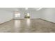 Bright living room featuring light wood floors, white walls, and natural light from windows and skylights at 662 Sausalito Blvd, Casselberry, FL 32707