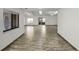 Spacious living room with wood-look flooring, abundant natural light, and a neutral color palette at 662 Sausalito Blvd, Casselberry, FL 32707