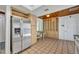 Kitchen area with stainless steel refrigerator and built in shelving and cabinetry at 721 Glenridge Way, Winter Park, FL 32789