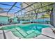 Sparkling screened-in pool with lounge seating and an adjacent sunroom for relaxing by the water at 721 Glenridge Way, Winter Park, FL 32789