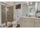 Bathroom featuring a glass-enclosed shower, neutral walls, and a single sink vanity at 8005 Flip Flop Way, Kissimmee, FL 34747