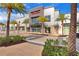 Exterior view of a Commercial building with a stone facade and palm trees at 8005 Flip Flop Way, Kissimmee, FL 34747