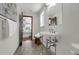 Bright bathroom featuring pedestal sink, tiled floors, and an open view to a bedroom at 9332 Windy Ridge Rd, Windermere, FL 34786