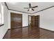 Bedroom with wood floor, closet, and bright window offering natural light at 9332 Windy Ridge Rd, Windermere, FL 34786