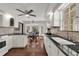 Bright kitchen with granite counters, tiled backsplash, and stainless steel appliances at 9332 Windy Ridge Rd, Windermere, FL 34786