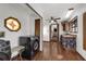 Practical laundry area with modern appliances, stained glass window, and wooden floors at 9332 Windy Ridge Rd, Windermere, FL 34786