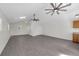 A living room featuring vaulted ceilings, modern floors, and ample natural light at 9332 Windy Ridge Rd, Windermere, FL 34786