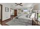 Well-lit main bedroom with hardwood floors, a walk-in closet, and bright windows at 9332 Windy Ridge Rd, Windermere, FL 34786