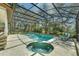 Large screened in pool with plenty of space for lounge chairs at 9332 Windy Ridge Rd, Windermere, FL 34786