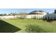 Well-maintained backyard with vibrant green grass and privacy fence at 9716 Royal Vista Ave, Clermont, FL 34711