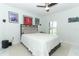 Bedroom features a ceiling fan, wall decor and a large bed at 9716 Royal Vista Ave, Clermont, FL 34711