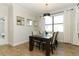 Dining room features wood flooring, lots of natural light and seating for four at 9716 Royal Vista Ave, Clermont, FL 34711