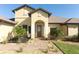 Inviting entryway with a decorative glass door and manicured landscaping at 9716 Royal Vista Ave, Clermont, FL 34711