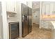 Kitchen featuring stainless steel appliances and wine cooler at 9716 Royal Vista Ave, Clermont, FL 34711