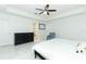 Bright main bedroom showcasing ceiling fan and white marble floors at 9716 Royal Vista Ave, Clermont, FL 34711