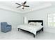 Bright bedroom with a ceiling fan and lots of natural light at 9716 Royal Vista Ave, Clermont, FL 34711