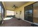 Screened lanai features a brick floor and ceiling fan for outdoor enjoyment at 9716 Royal Vista Ave, Clermont, FL 34711