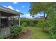 Beautiful backyard with a screened porch, lush plants, and a serene atmosphere at 978 Cobbler Ct, Longwood, FL 32750