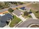 This aerial view shows homes in a residential neighborhood with solar panels on the roof at 1018 Highland Meadows St, Davenport, FL 33837