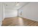 Spacious bedroom featuring laminate flooring, neutral paint, a ceiling fan, and ample natural light at 1018 Highland Meadows St, Davenport, FL 33837